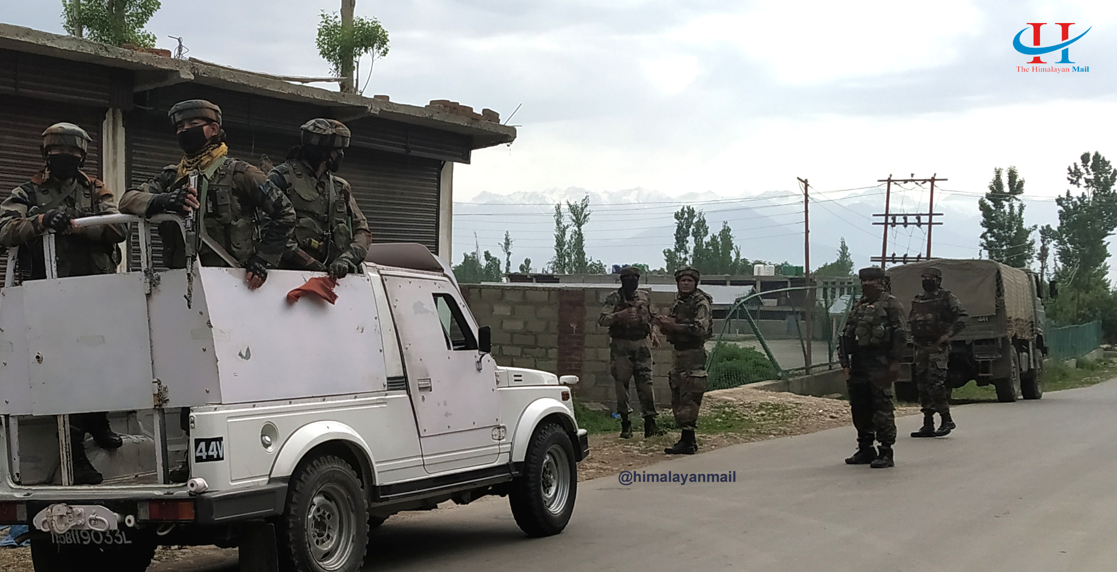Security personnel deployed after an IED was found from a santro car in Rajpora village of Pulwama district in Kashmir