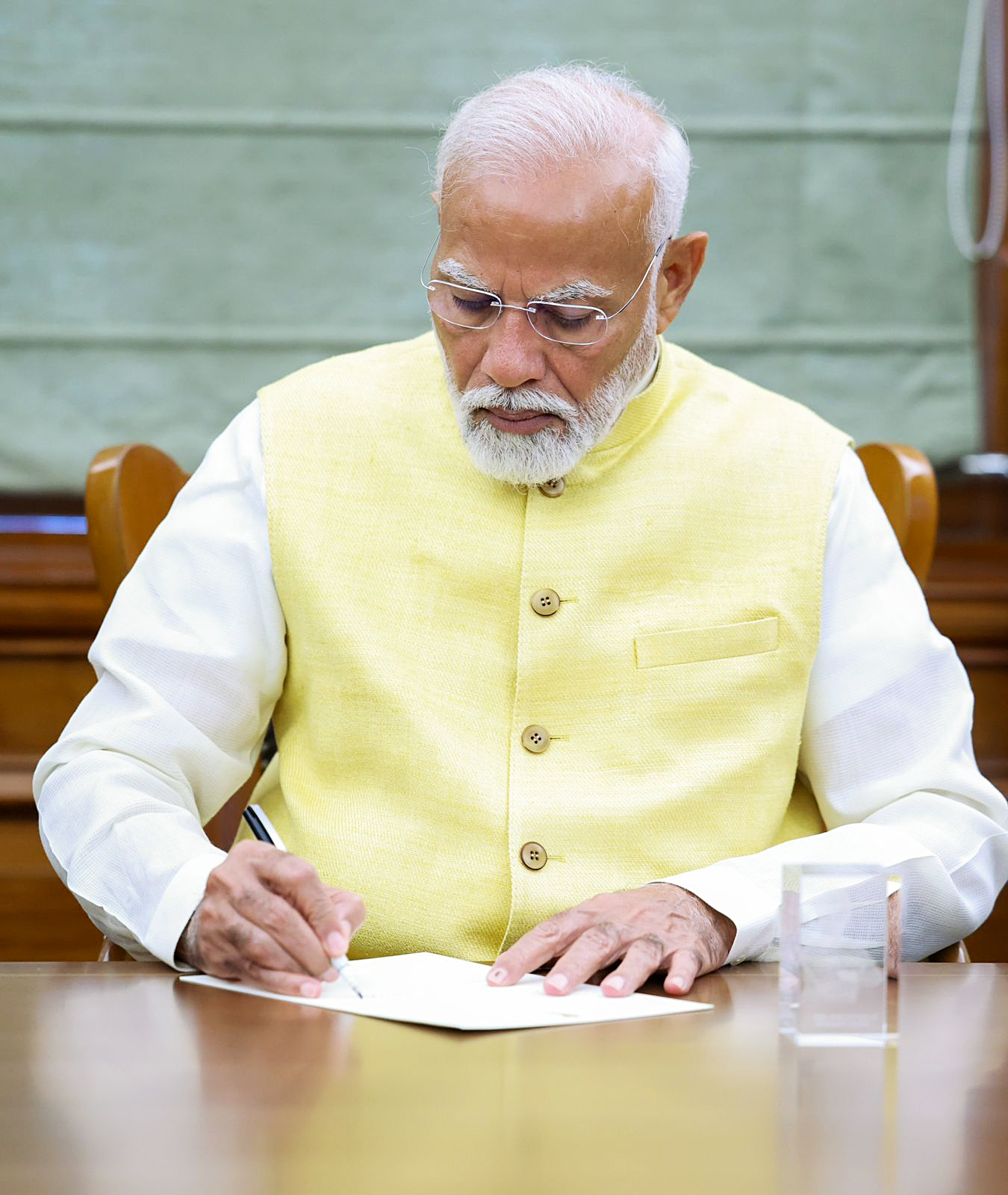 On first day in office as 3rd time PM, Modi signs file on Kisan Welfare.